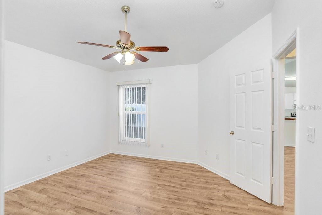 517 Royal Ridge Street Valrico, FL 33594 - Photo 12 of 30 a view of empty room with wooden floor and fan