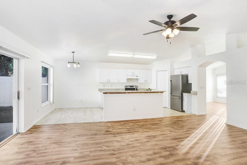 517 Royal Ridge Street Valrico, FL 33594 - Photo 7 of 30 a view of a kitchen with kitchen island a sink stainless steel appliances and cabinets