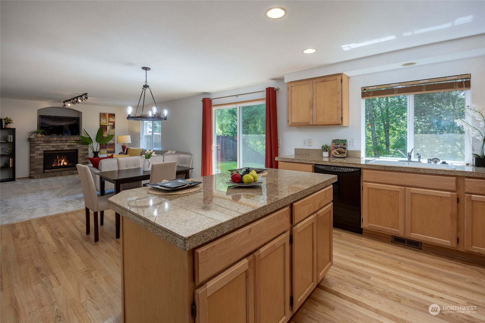 14439 Southeast 185th Place Renton, WA 98058 - Photo 13 of 36 a kitchen with stainless steel appliances granite countertop a sink stove and cabinets