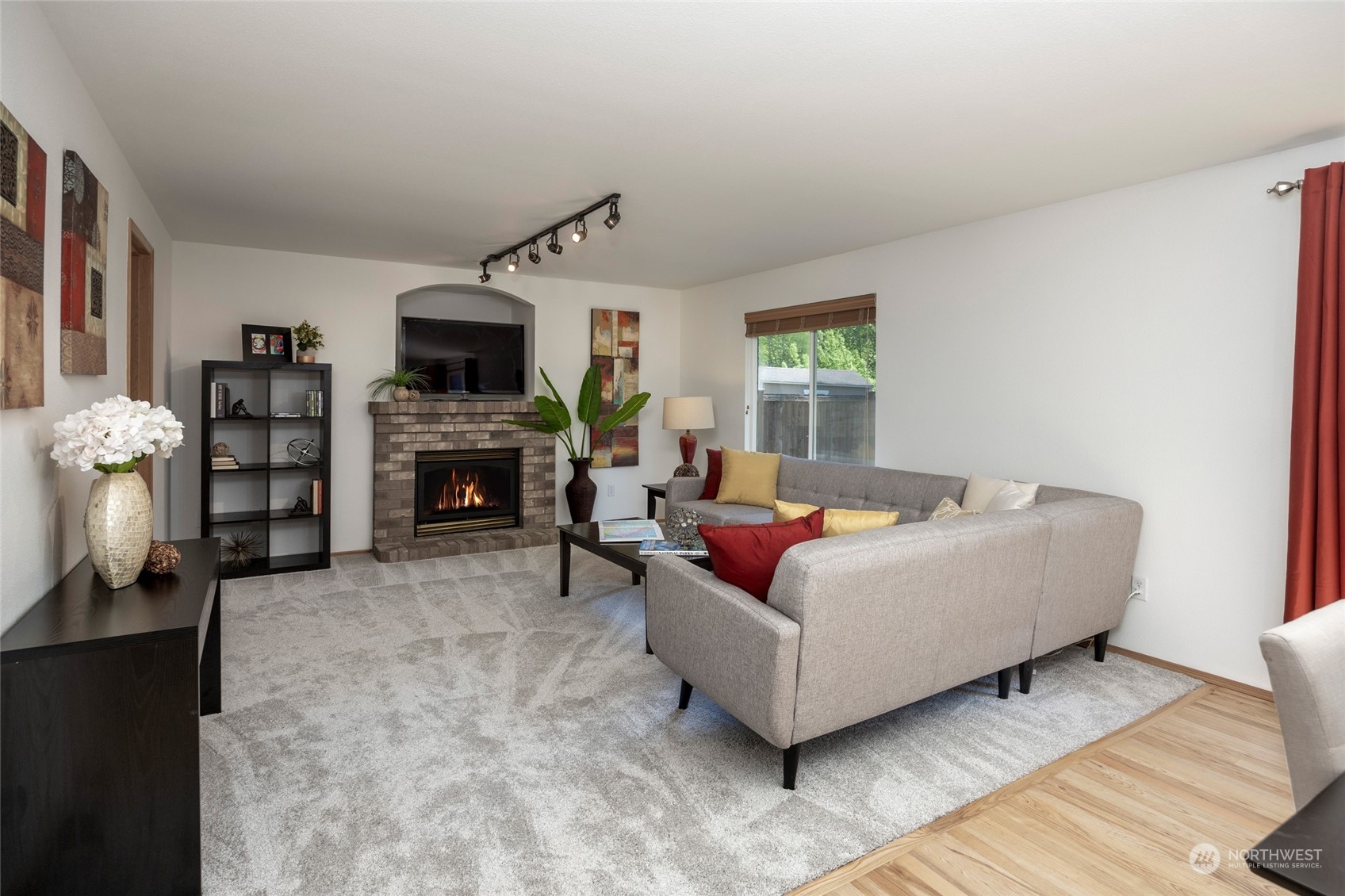 14439 Southeast 185th Place Renton, WA 98058 - Photo 17 of 36 a living room with furniture and a flat screen tv