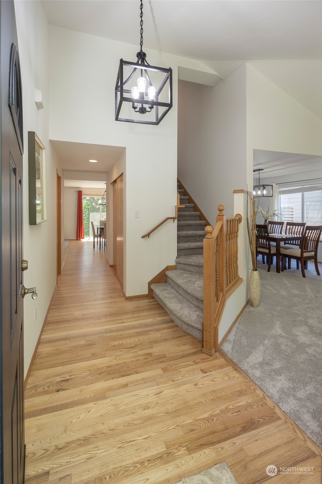 14439 Southeast 185th Place Renton, WA 98058 - Photo 2 of 36 a view of a livingroom with furniture wooden floor and chandelier