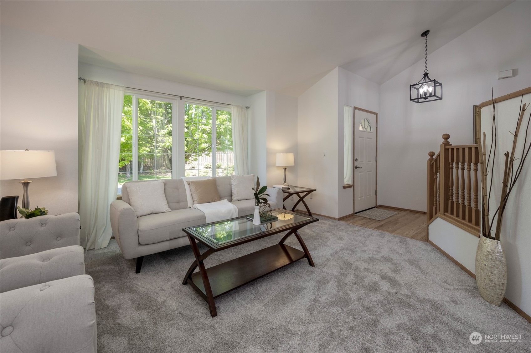 14439 Southeast 185th Place Renton, WA 98058 - Photo 3 of 36 a living room with furniture and a large window