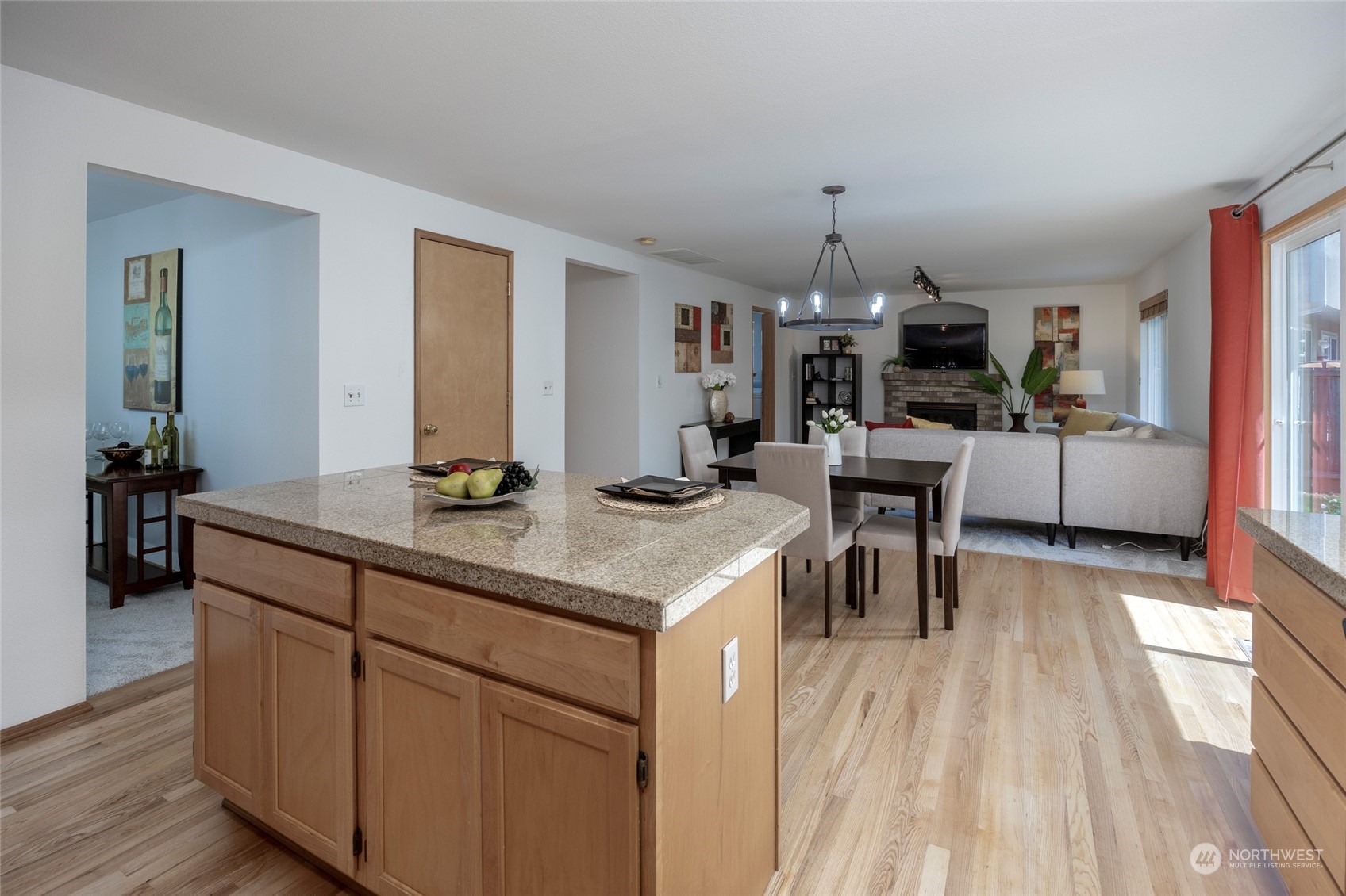 14439 Southeast 185th Place Renton, WA 98058 - Photo 10 of 36 a kitchen with sink cabinets and wooden floor
