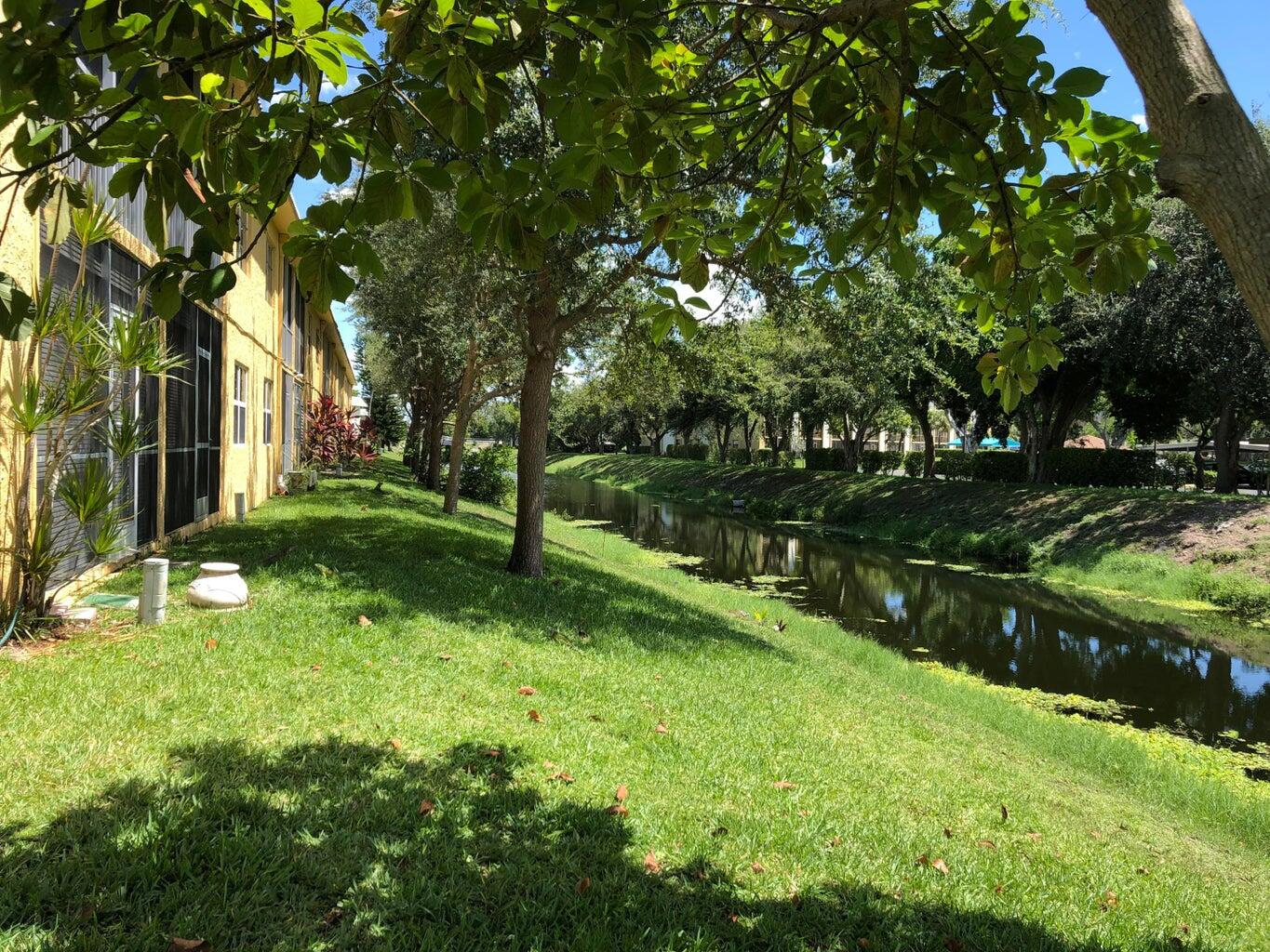 9826 Marina Boulevard, Unit 1023 Boca Raton, FL 33428 - Photo 21 of 31 a view of a park with large trees