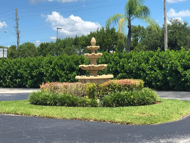 a view of a garden with a fountain