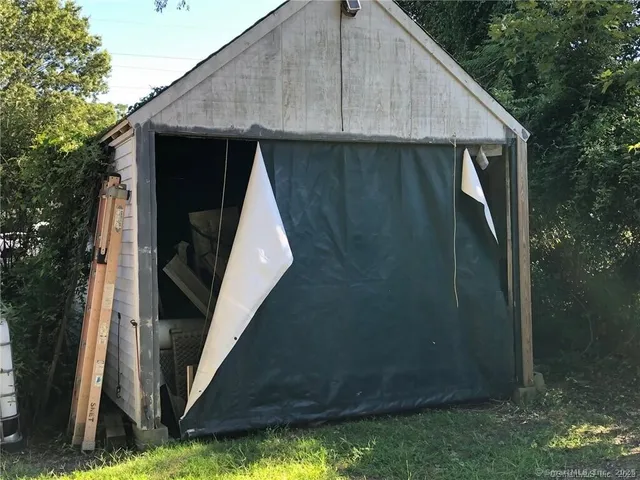 a utility room with a car parked