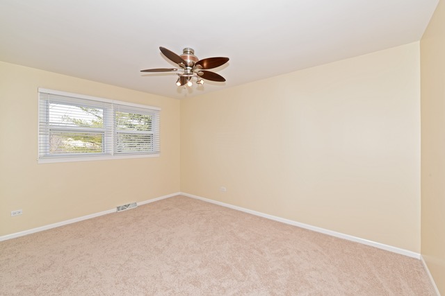 7706 Sawyer Road Darien, IL 60561 - Photo 6 of 10 an empty room with a window