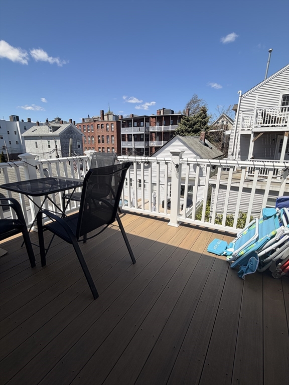 562 East 7th Street, Unit 2 Boston, MA 02127 - Photo 2 of 18 a view of a balcony with chairs