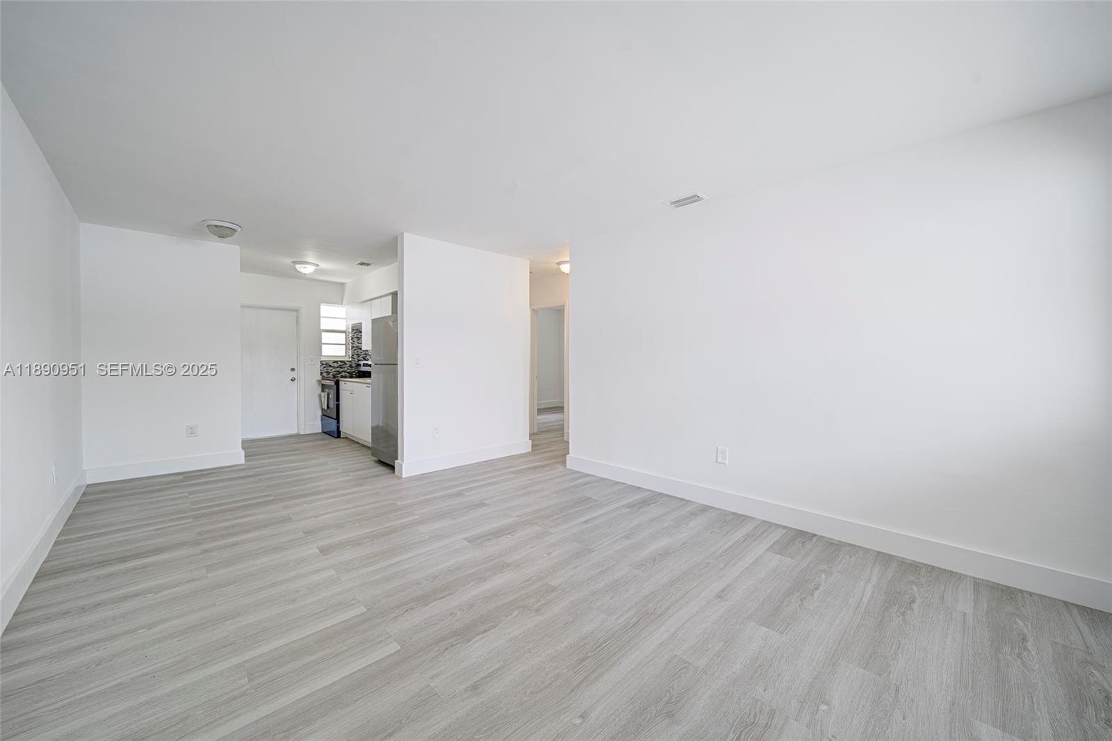 6735 Northwest 2nd Court, Unit 1 Miami, FL 33150 - Photo 1 of 27 a view of empty room with wooden floor