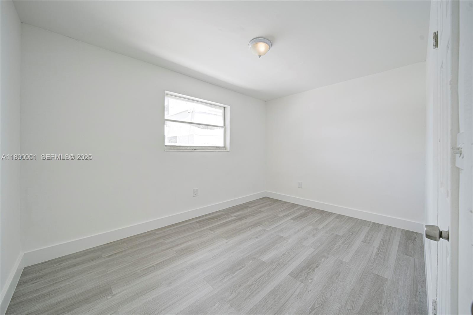 6735 Northwest 2nd Court, Unit 1 Miami, FL 33150 - Photo 20 of 27 wooden floor in an empty room