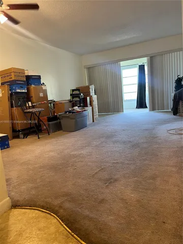 a bed room with furniture and a window