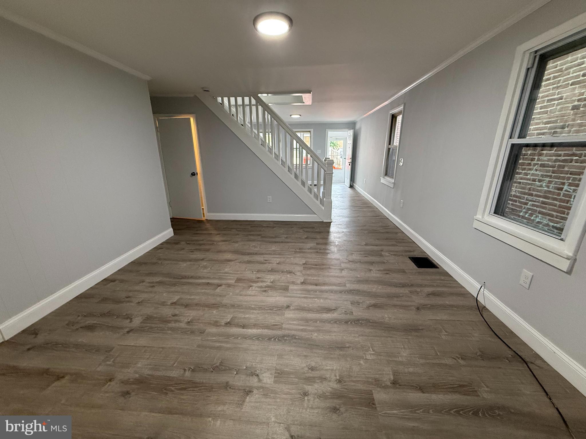 340 Middlesex Street Gloucester City, NJ 08030 - Photo 11 of 35 a view of entryway and hall with wooden floor