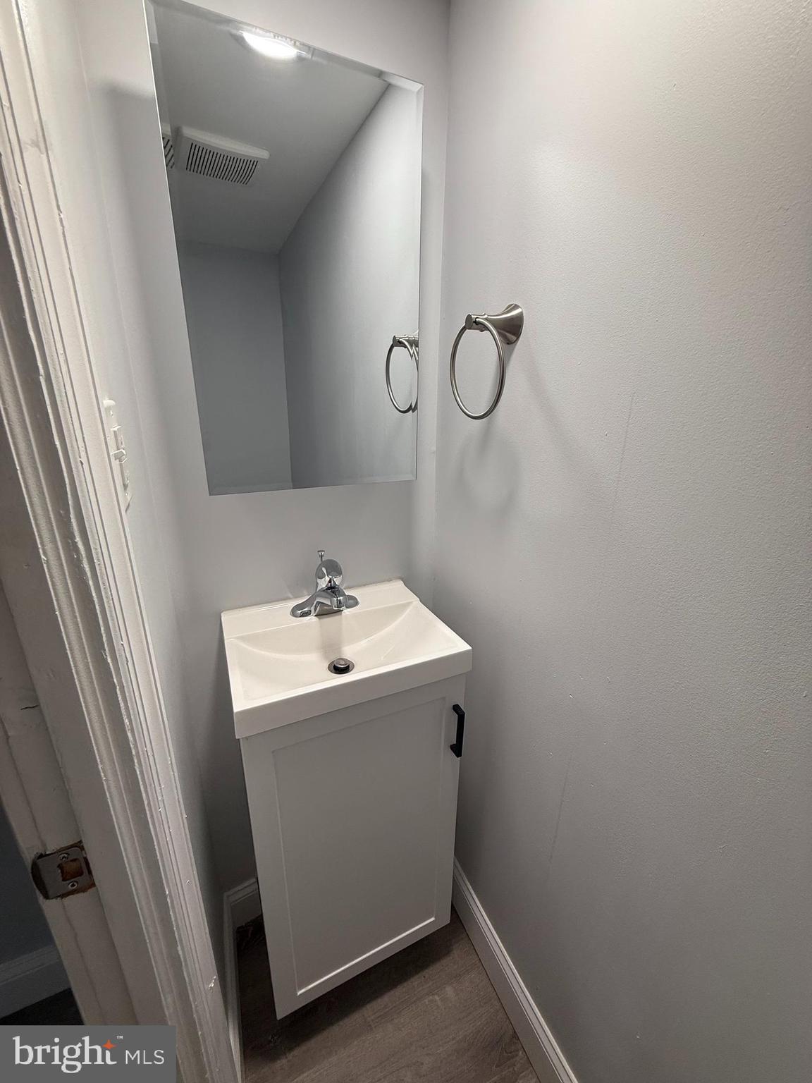 340 Middlesex Street Gloucester City, NJ 08030 - Photo 13 of 35 a bathroom with a sink and mirror