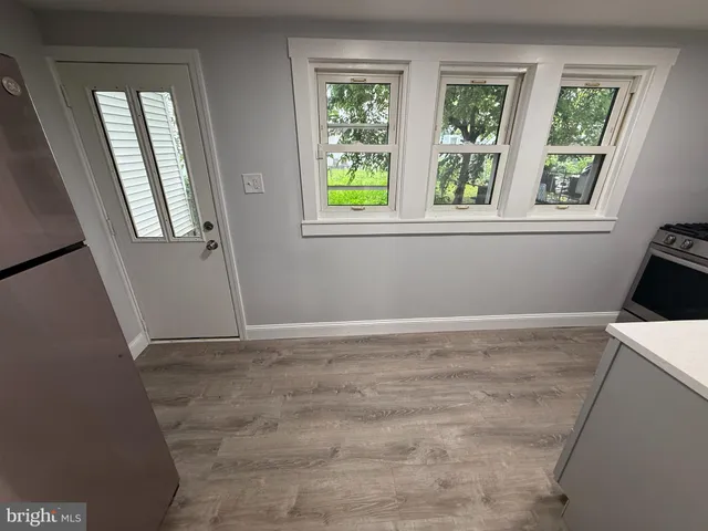 a kitchen with a stove and a refrigerator