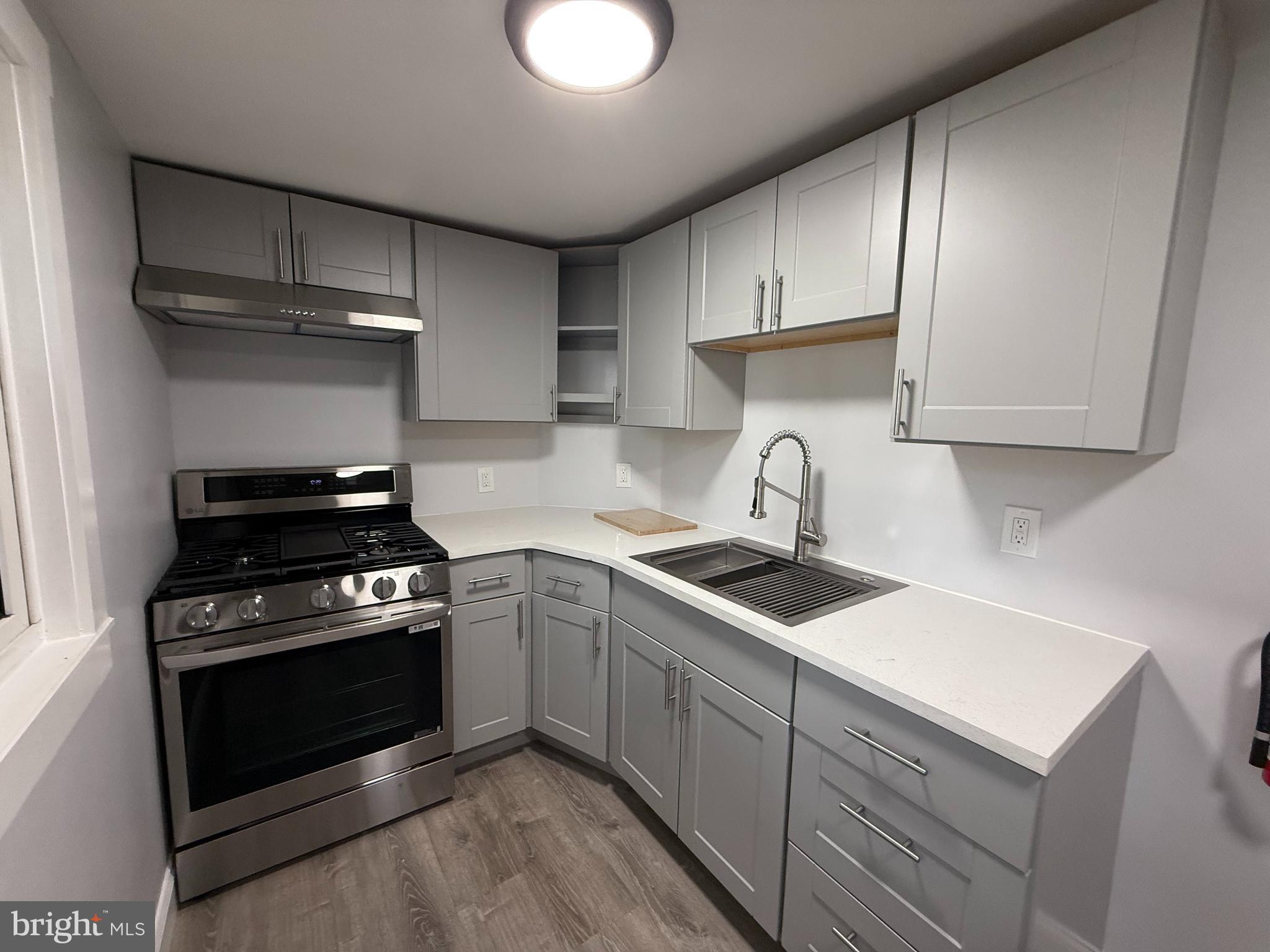 340 Middlesex Street Gloucester City, NJ 08030 - Photo 17 of 35 a kitchen with cabinets appliances and a sink
