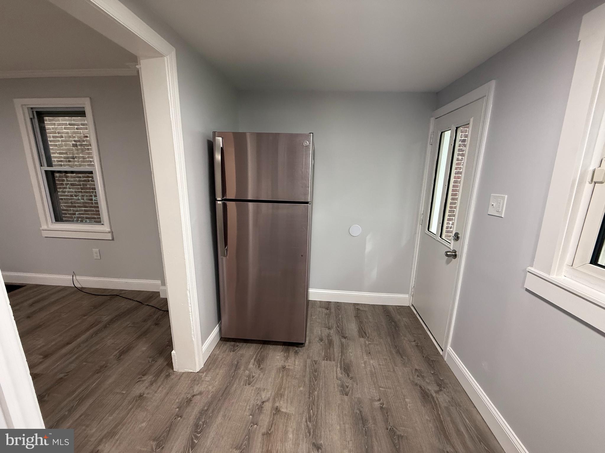 340 Middlesex Street Gloucester City, NJ 08030 - Photo 18 of 35 an empty room with wooden floor and window