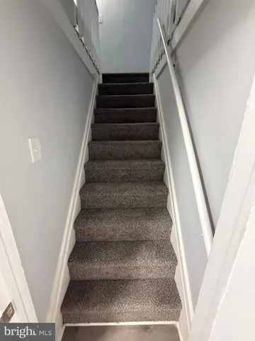 a view of a hallway with staircase