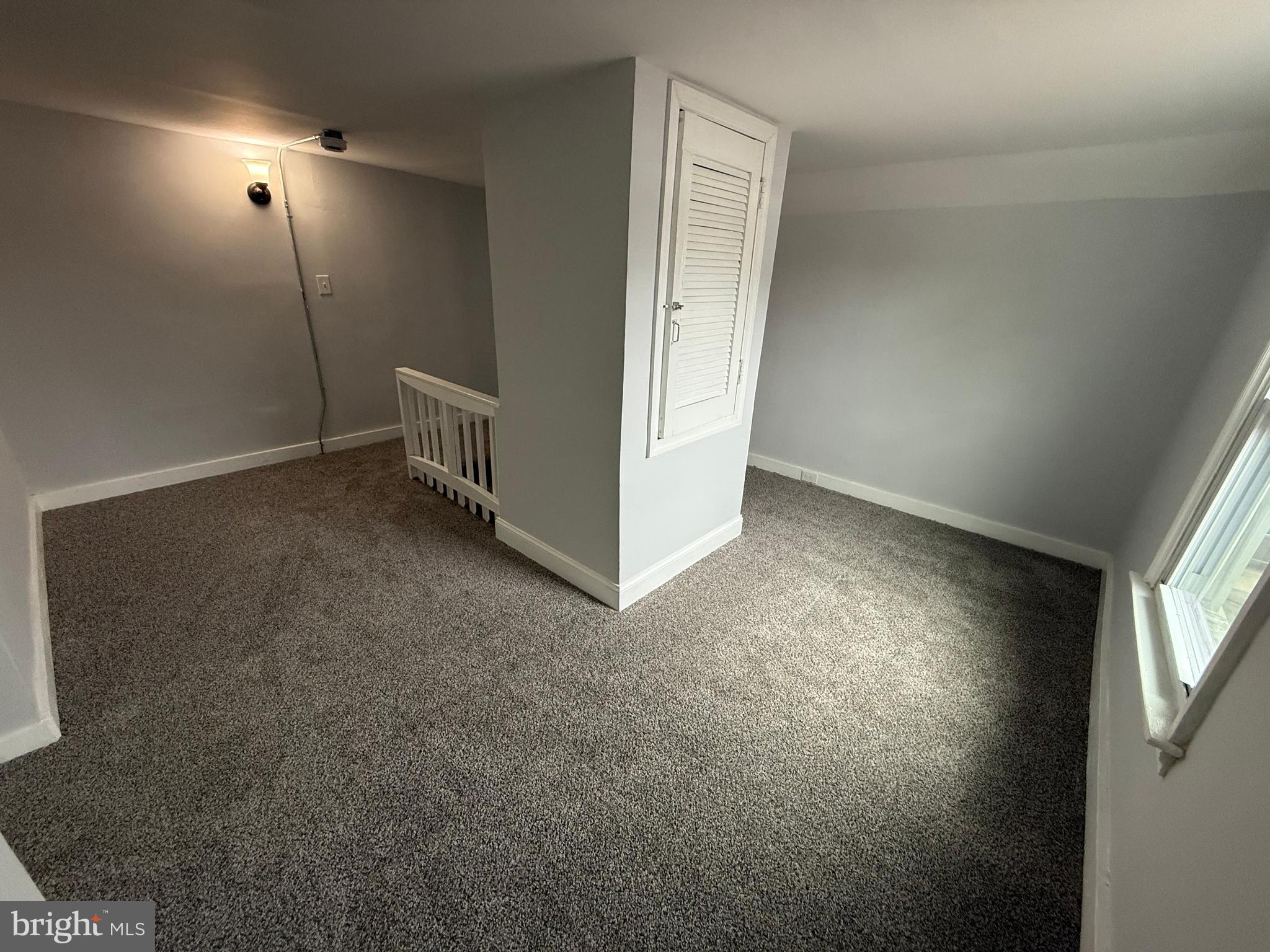 340 Middlesex Street Gloucester City, NJ 08030 - Photo 32 of 35 a view of a livingroom with an empty space and a window