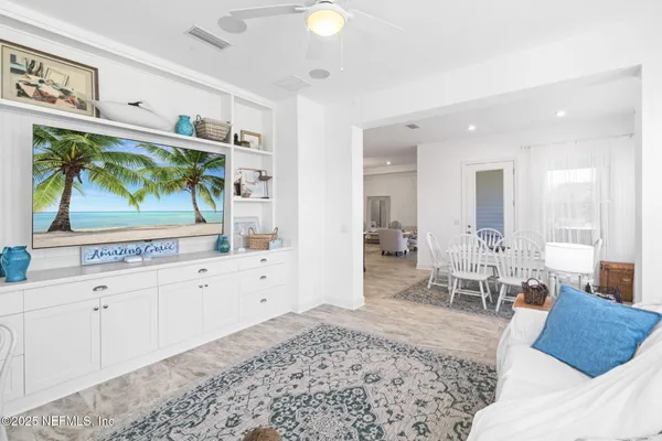 a view of walk in closet with clothes