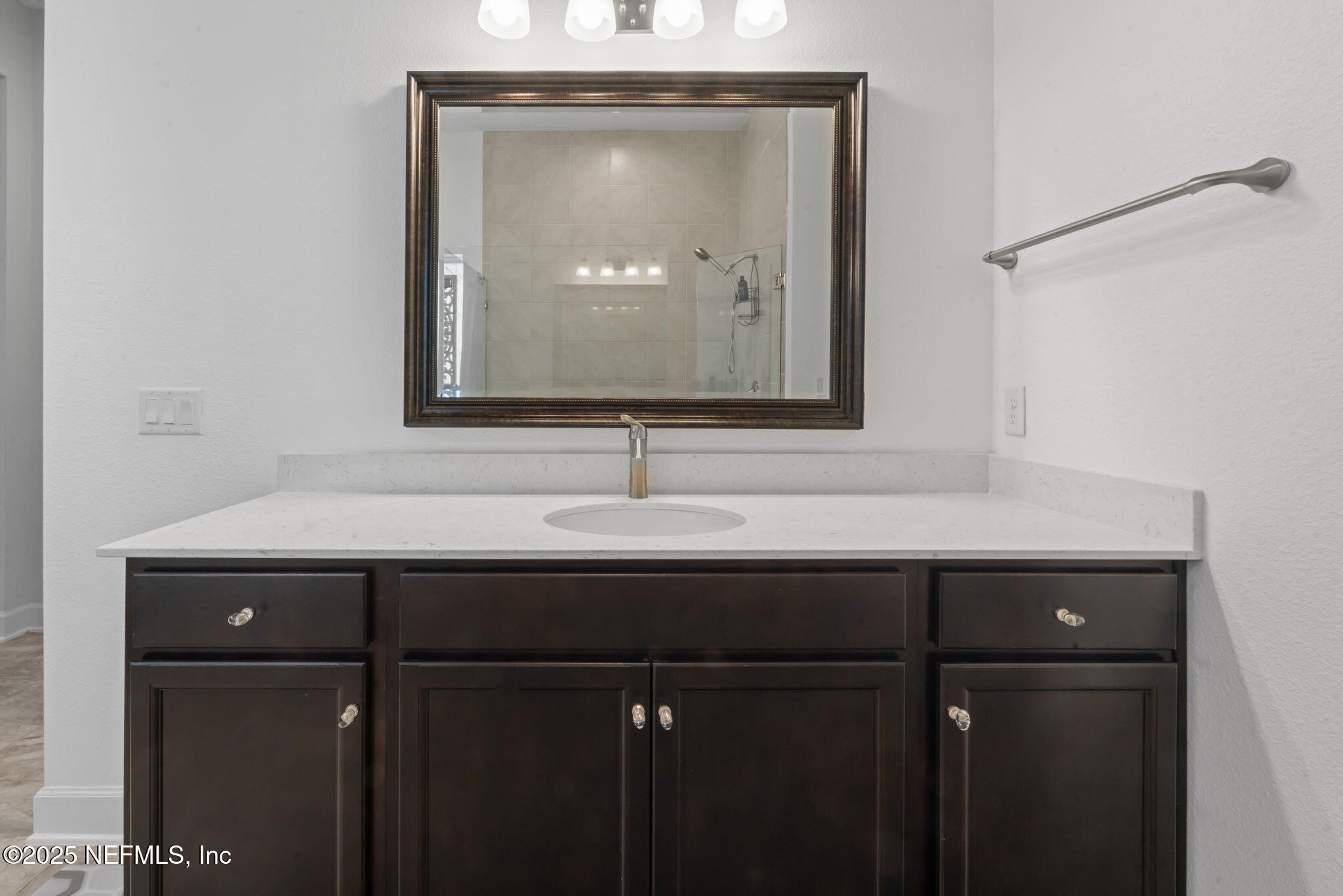 63 Braddock Court St. Augustine, FL 32092 - Photo 29 of 64 a bathroom with a sink and mirror