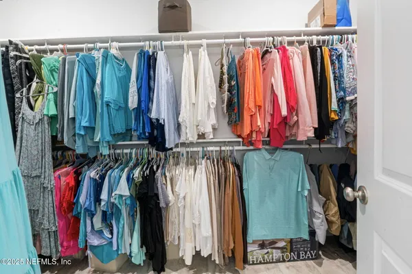 a view of a storage and utility room with washer and dryer