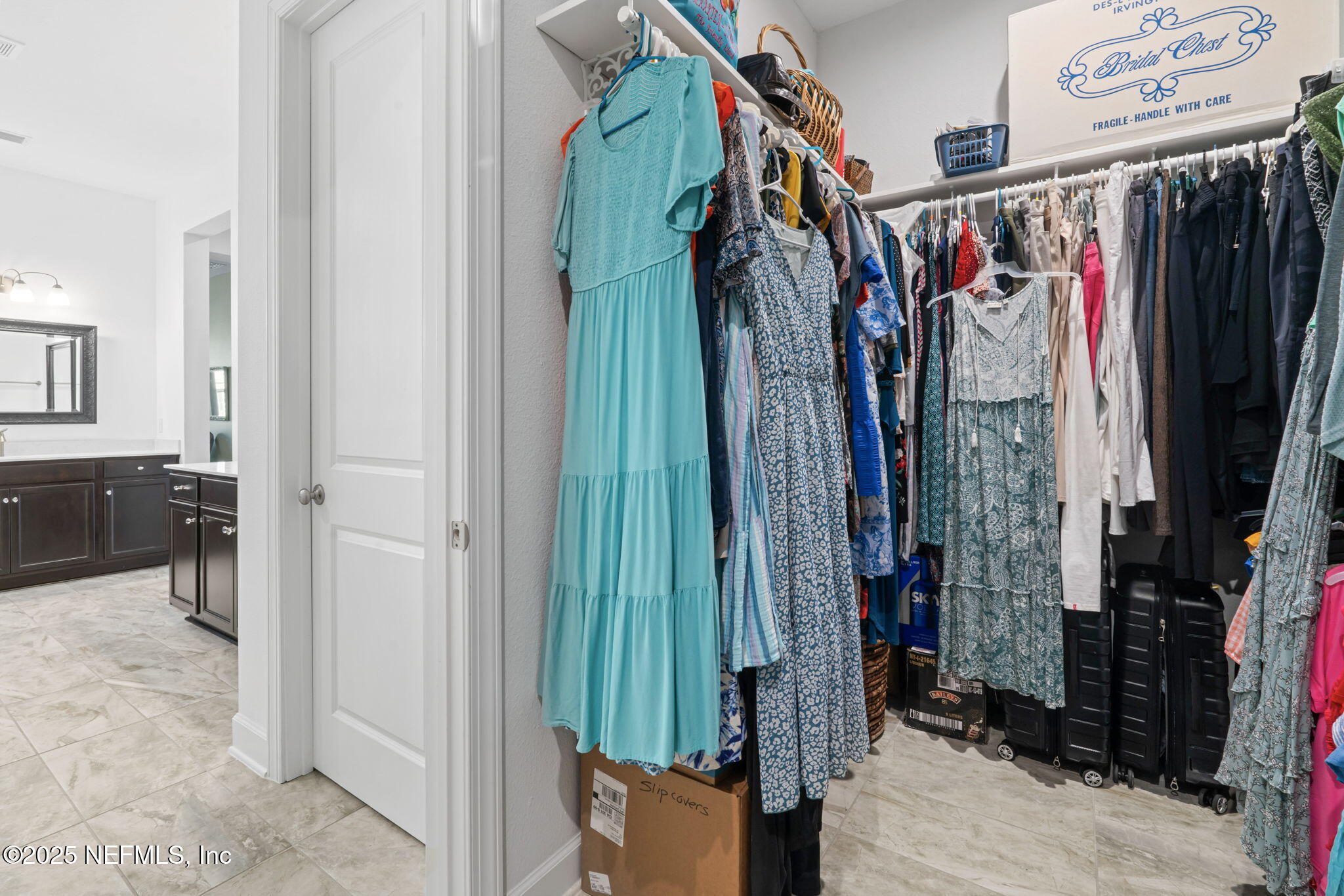 63 Braddock Court St. Augustine, FL 32092 - Photo 32 of 64 a view of walk in closet with clothes