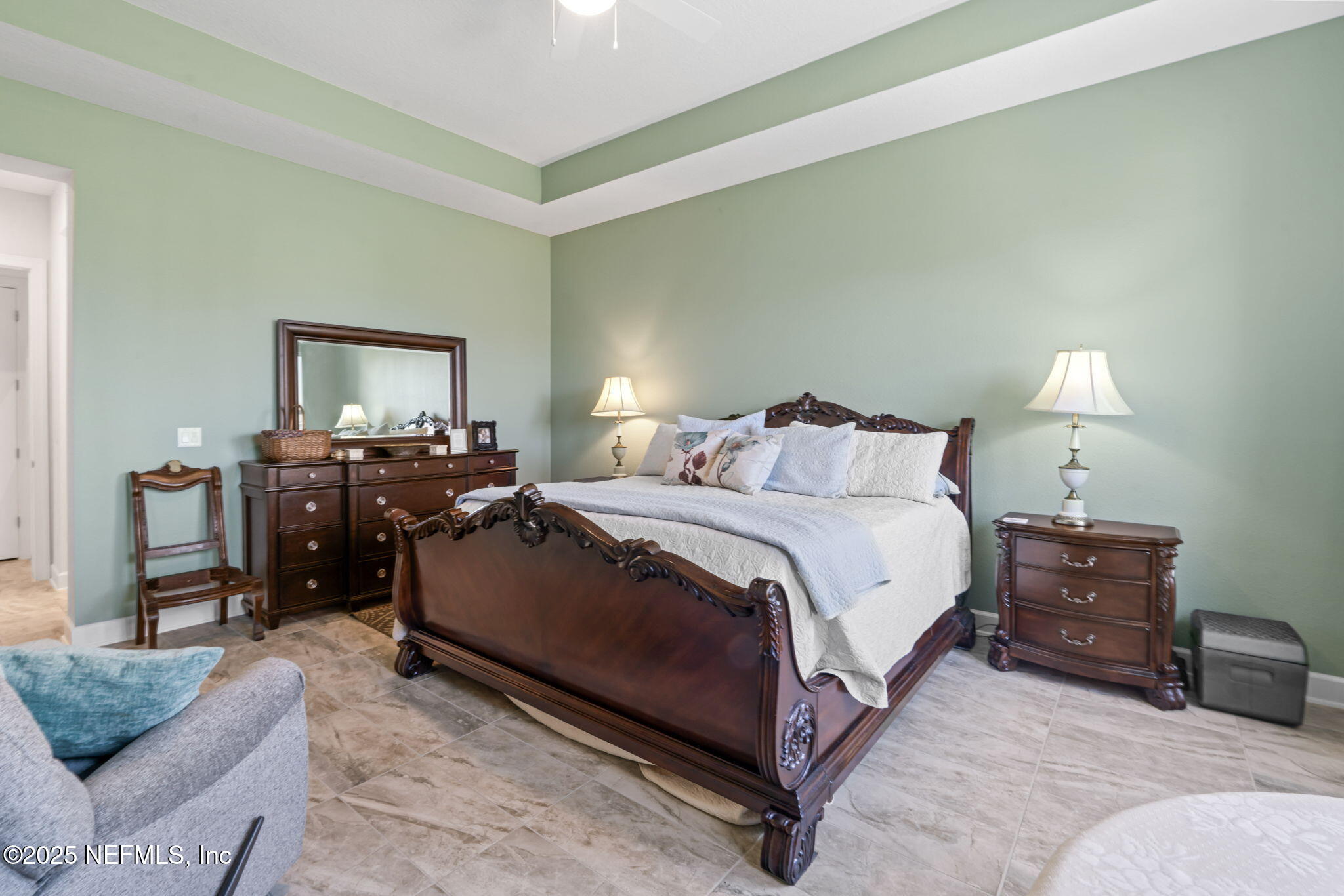 63 Braddock Court St. Augustine, FL 32092 - Photo 34 of 64 a bedroom with a bed and a lamp on dresser