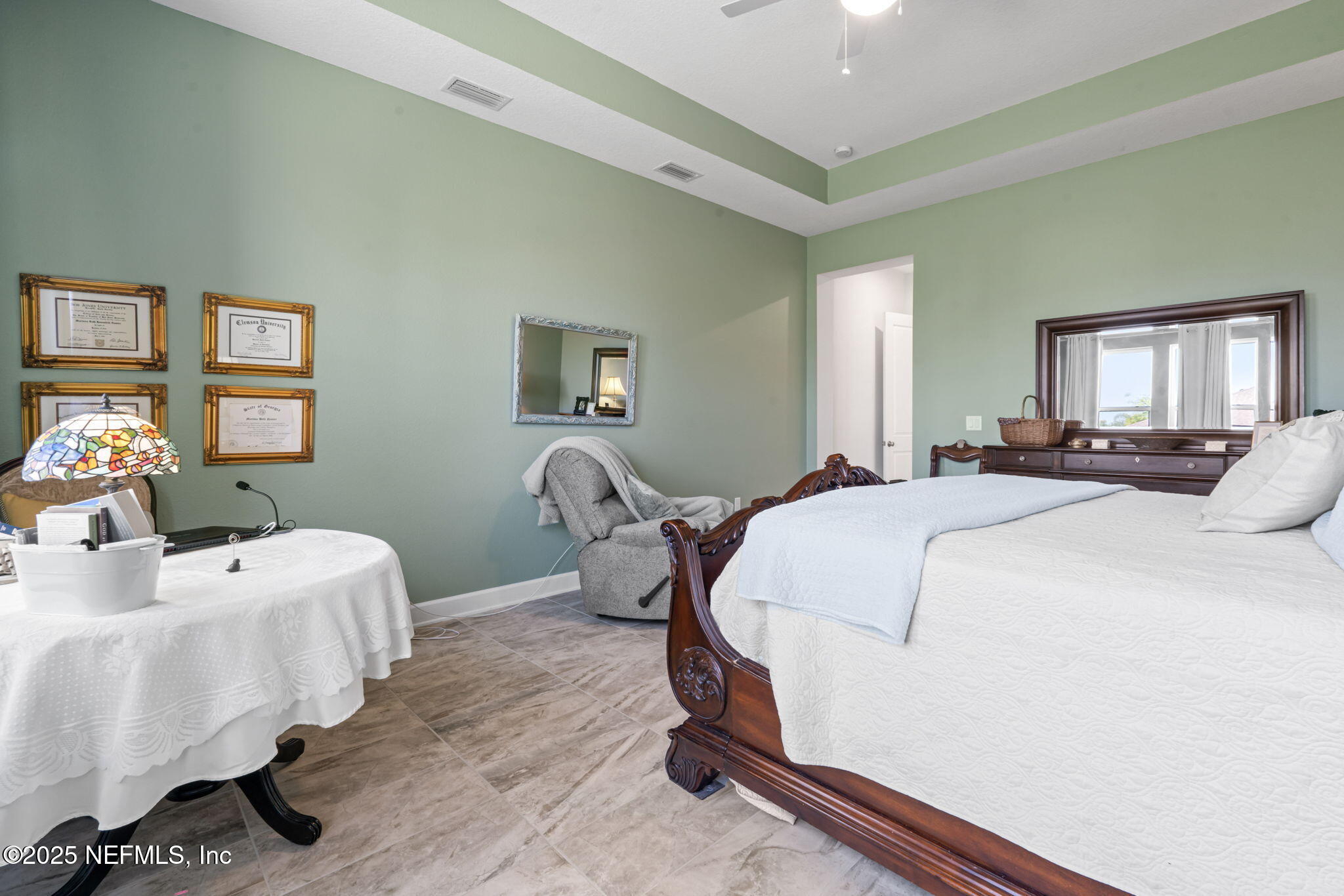 63 Braddock Court St. Augustine, FL 32092 - Photo 35 of 64 a bed room with a bed and a table