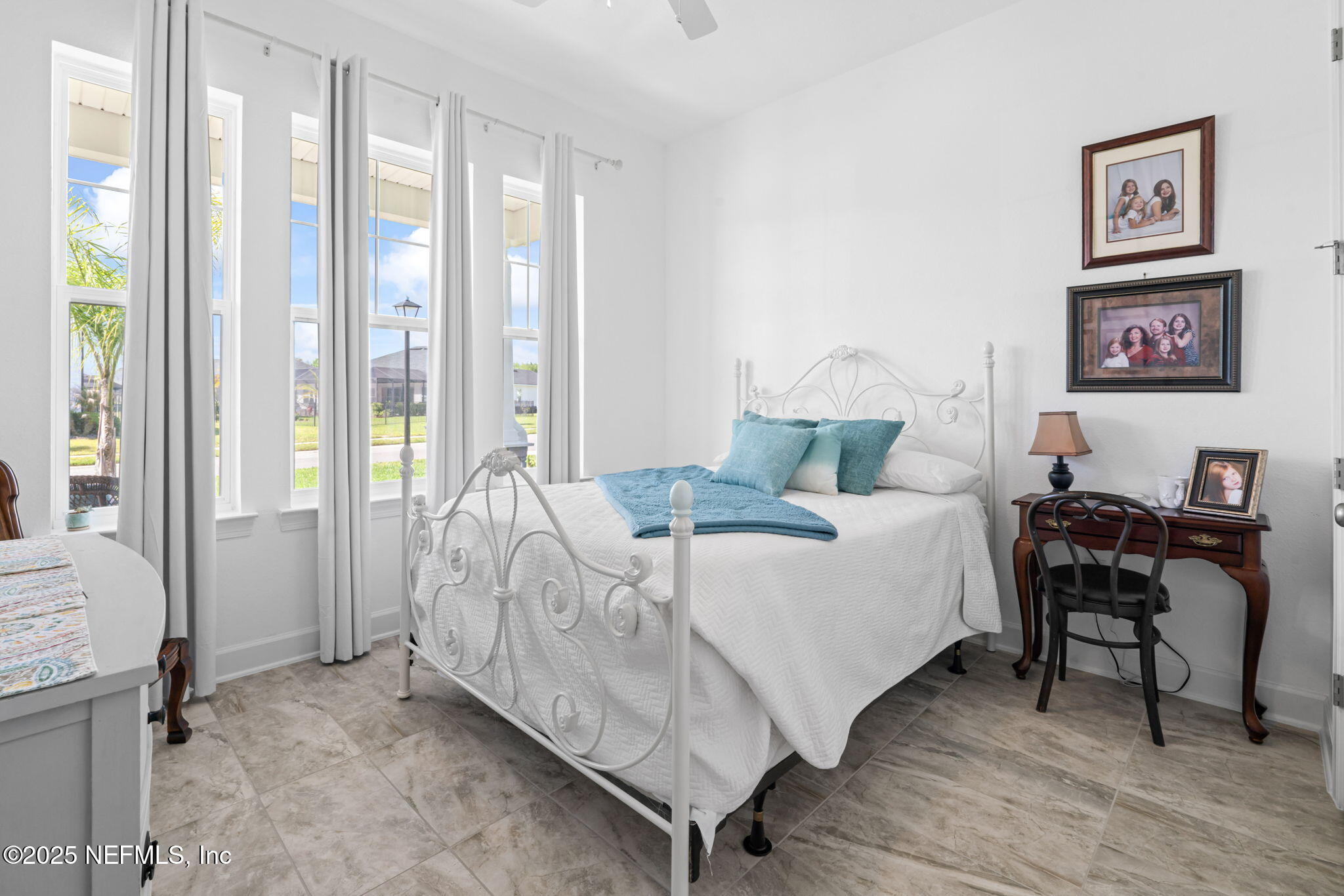63 Braddock Court St. Augustine, FL 32092 - Photo 37 of 64 a bed room with a bed and a chair