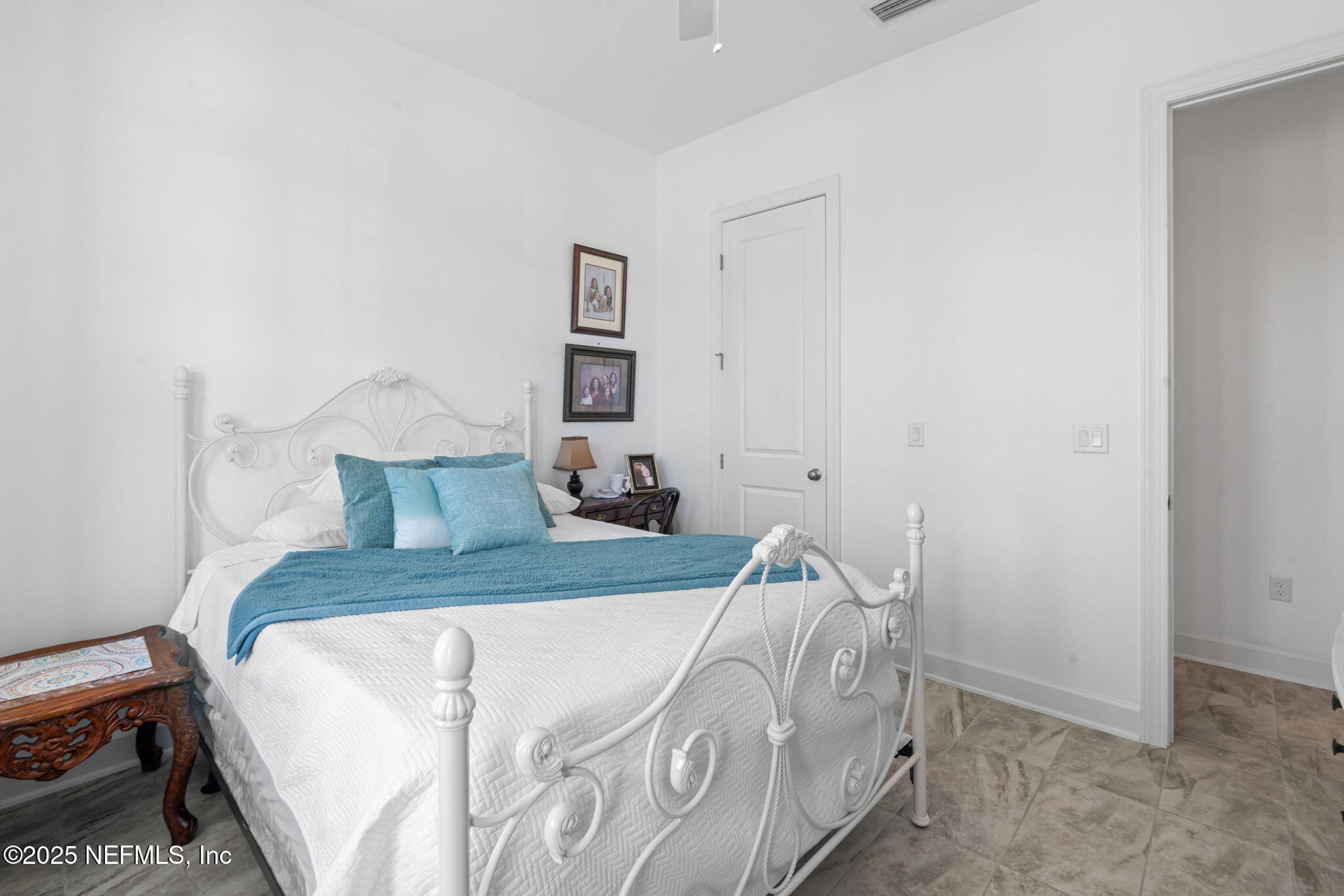 63 Braddock Court St. Augustine, FL 32092 - Photo 38 of 64 a bed sitting in a bedroom next to a window