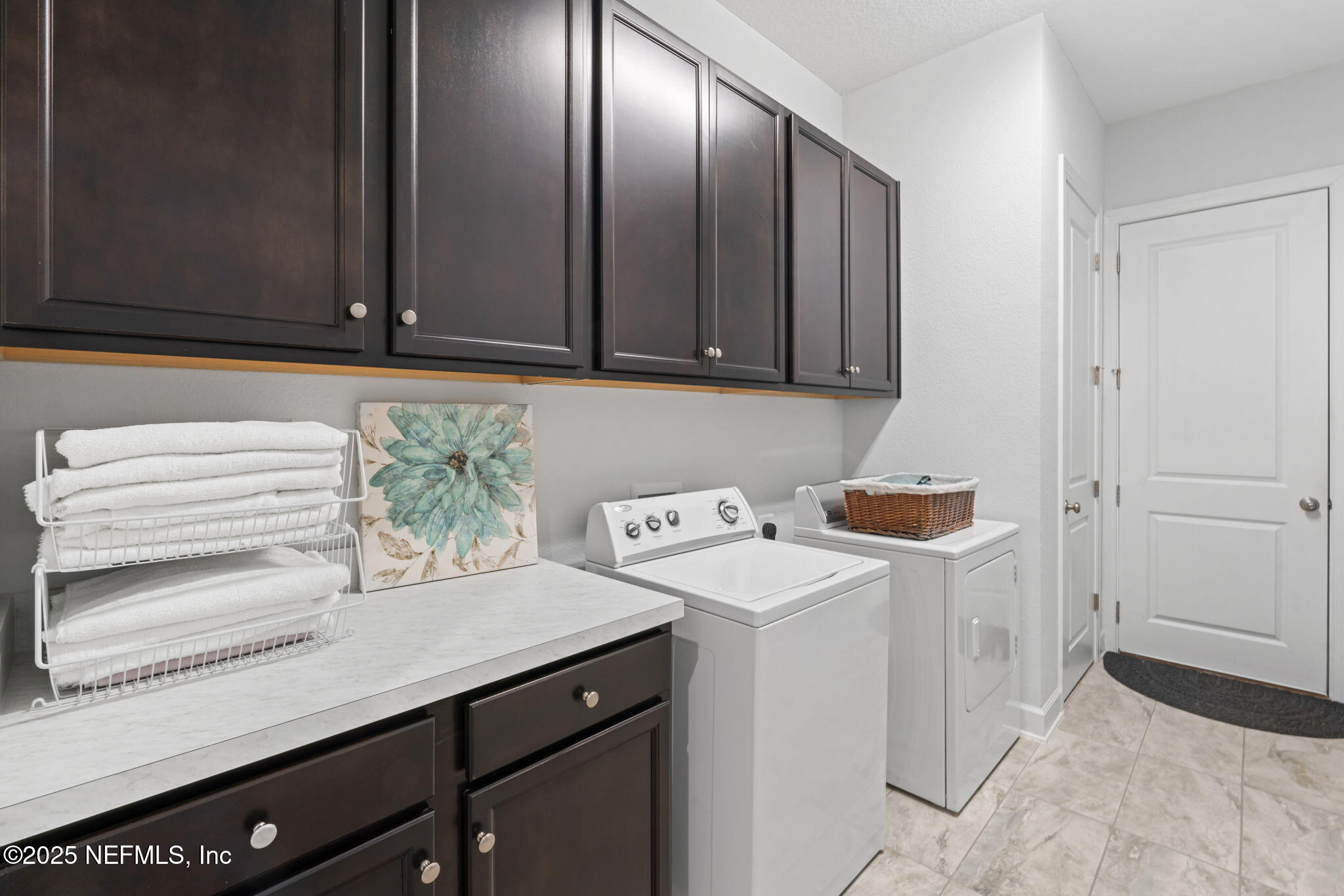 63 Braddock Court St. Augustine, FL 32092 - Photo 39 of 64 a view of a storage and utility room with washer and dryer