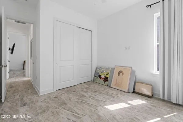 a view of a chairs and table in patio