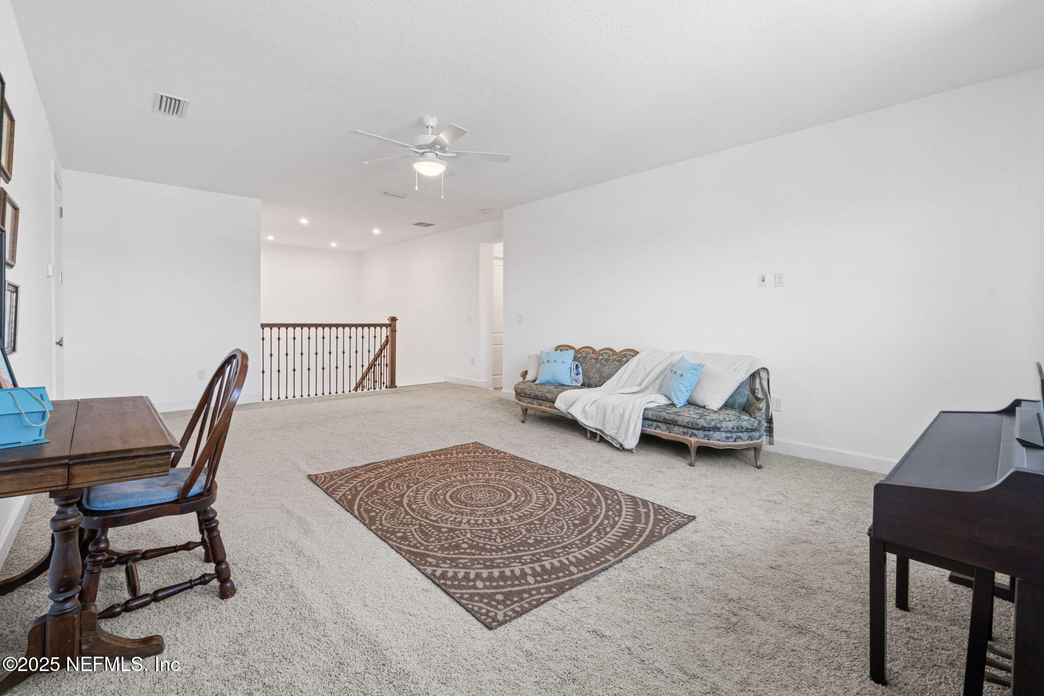 63 Braddock Court St. Augustine, FL 32092 - Photo 46 of 64 a living room with furniture rug and wooden floor