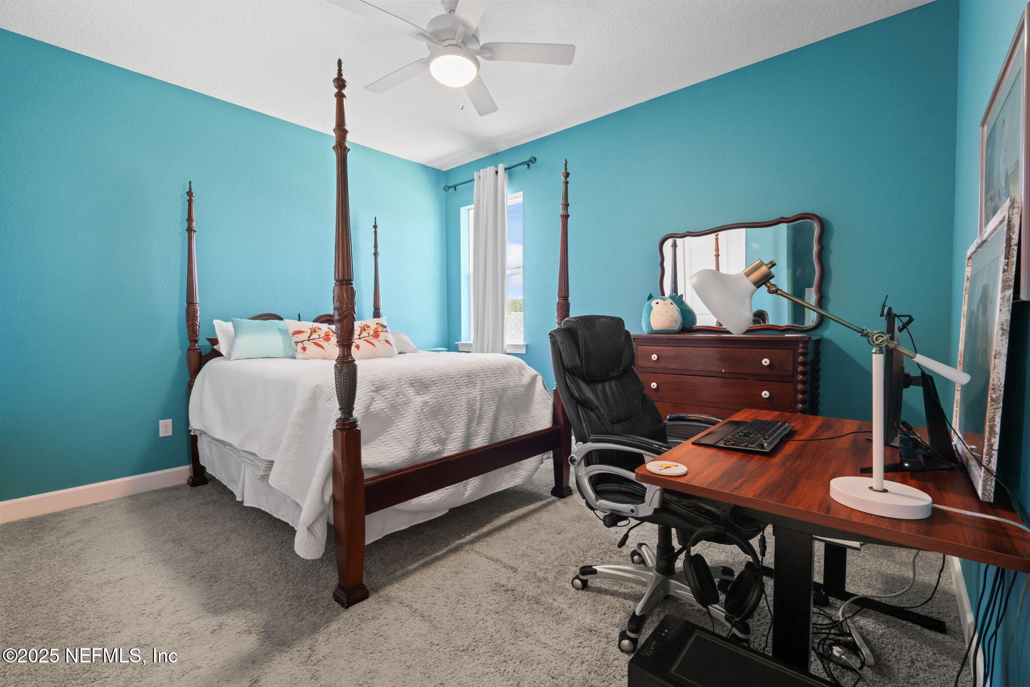 63 Braddock Court St. Augustine, FL 32092 - Photo 49 of 64 a bedroom with a bed table and chair