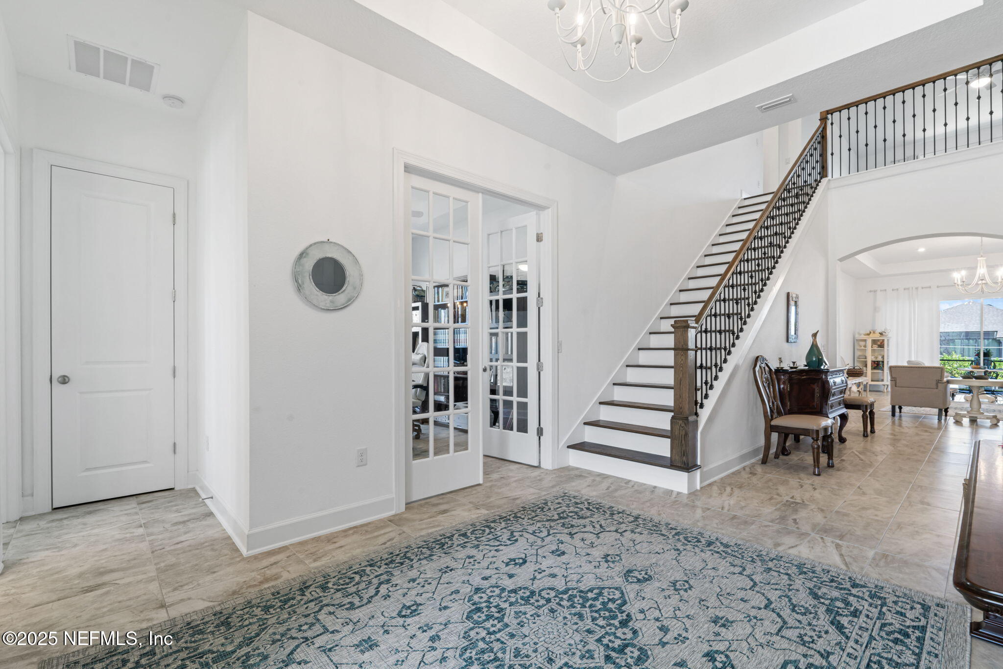 63 Braddock Court St. Augustine, FL 32092 - Photo 6 of 64 a view of entryway with stairs and wooden floor