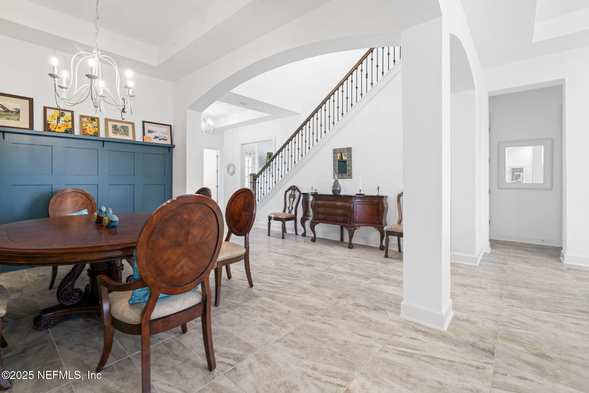 63 Braddock Court St. Augustine, FL 32092 - Photo 9 of 64 a view of dining room and livingroom with furniture wooden floor and chandelier