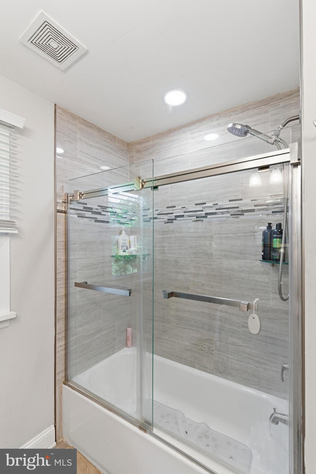 912 Shelley Road Towson, MD 21286 - Photo 17 of 27 a bathroom with a glass shower door