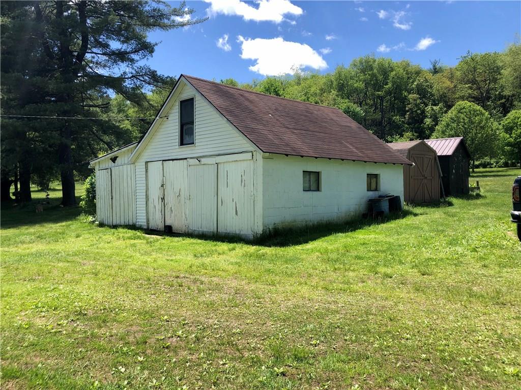 Parking area, Barn, Garage and Sheds.