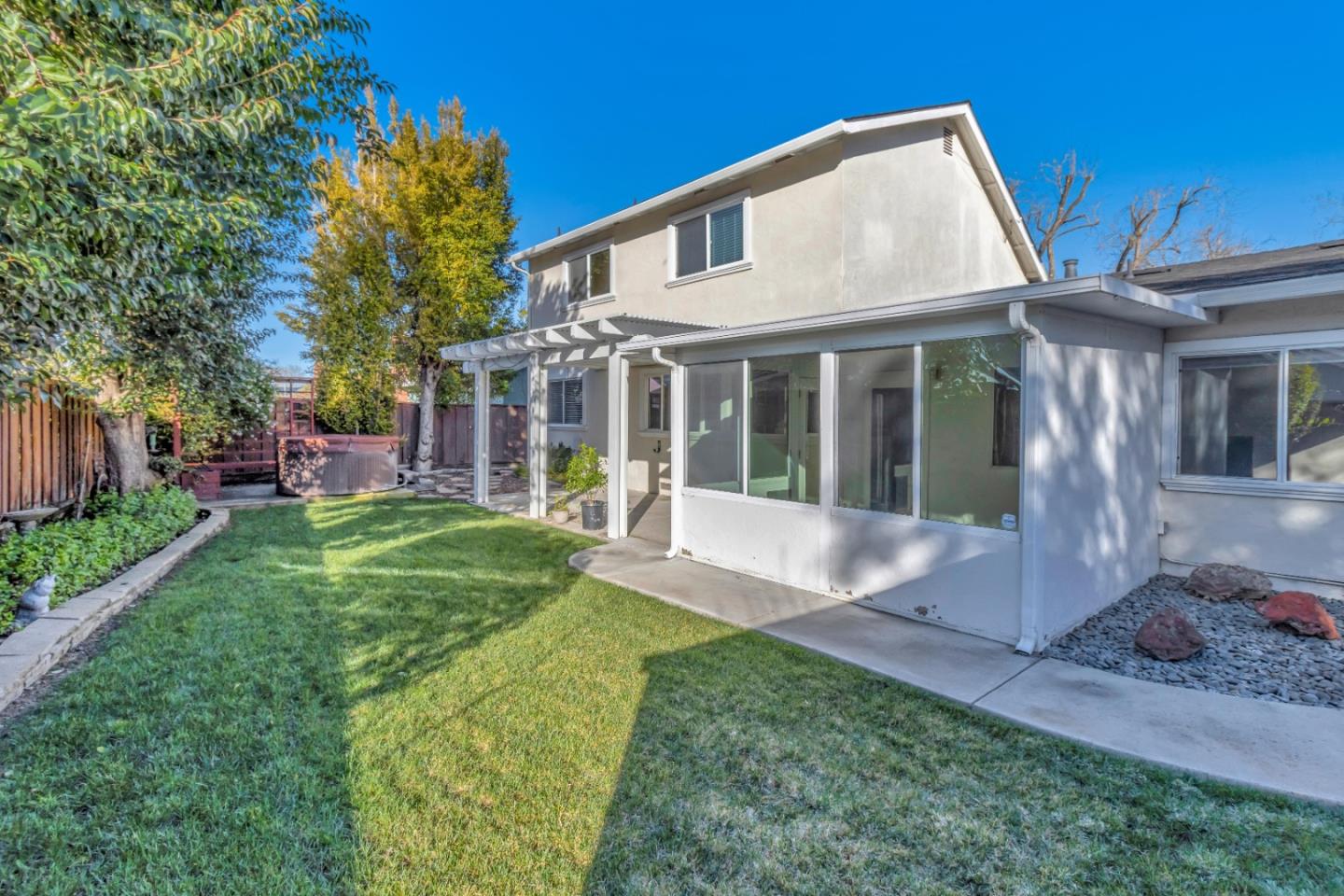 a front view of a house with a yard garden