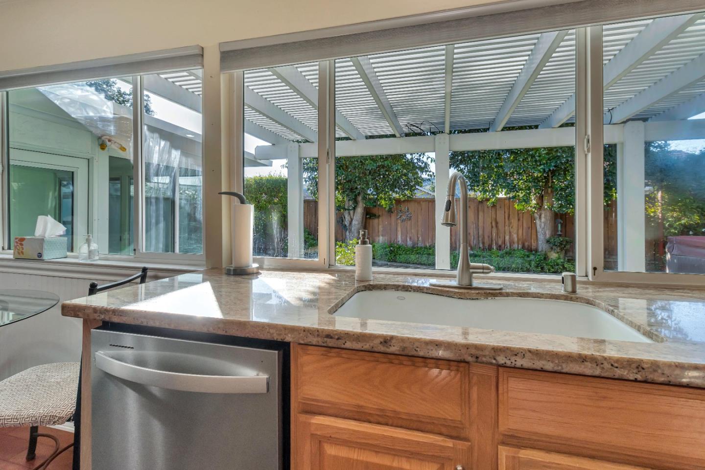 360 Henderson Drive San Jose, CA 95123 - Photo 11 of 37 a kitchen with granite countertop a sink and a large window