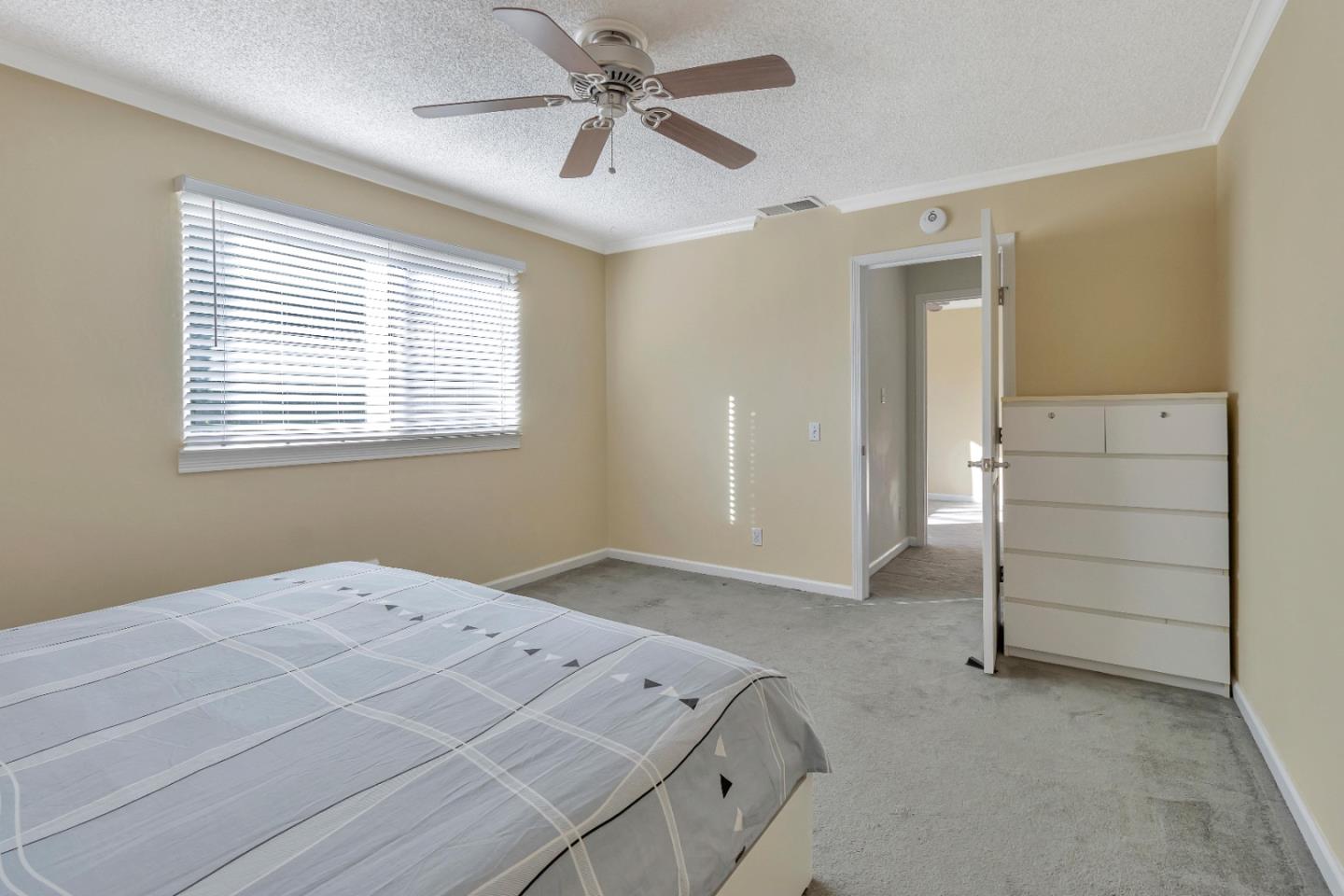 360 Henderson Drive San Jose, CA 95123 - Photo 21 of 37 a bedroom with a bed and a ceiling fan