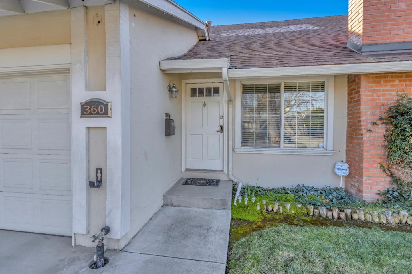 360 Henderson Drive San Jose, CA 95123 - Photo 3 of 37 a front view of a house with a garden