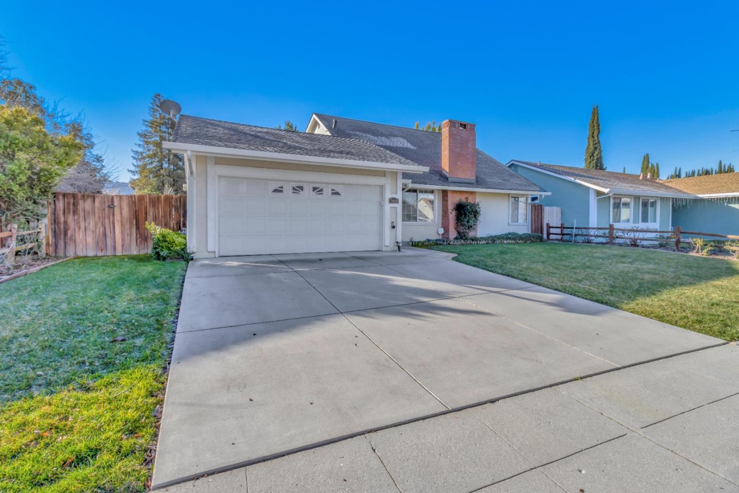 360 Henderson Drive San Jose, CA 95123 - Photo 4 of 37 a front view of a house with a yard and garage