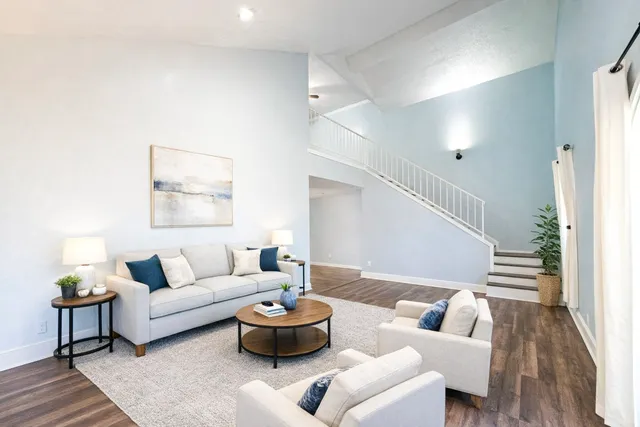 a living room with furniture and a table