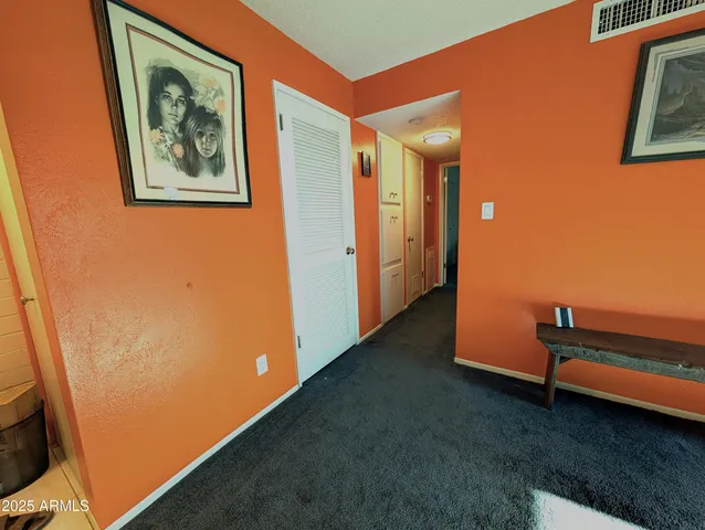 a view of room with window and a projector