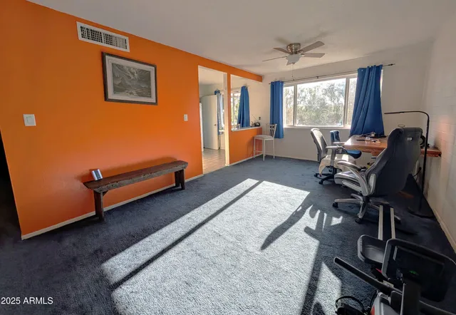 a bedroom with furniture and a window