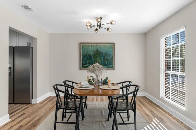 a view of a dining room with furniture window and outside view