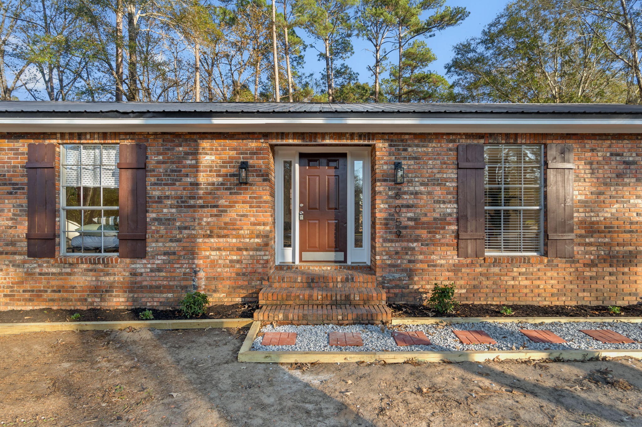 6059 Blueberry Lane Crestview, FL 32536 - Photo 6 of 36 a front view of a house with a yard