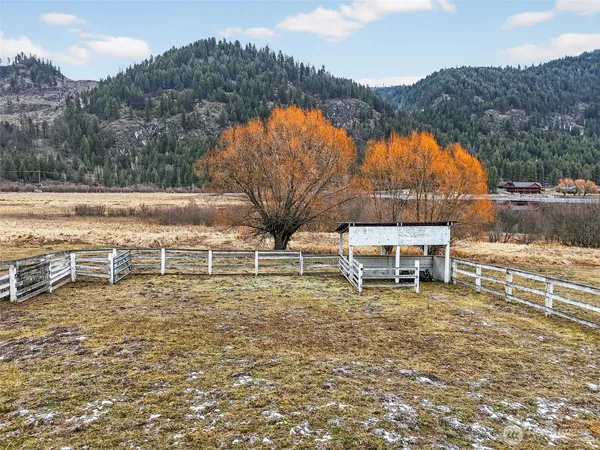 a view of a backyard with sitting area