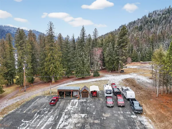 a view of street with parked cars